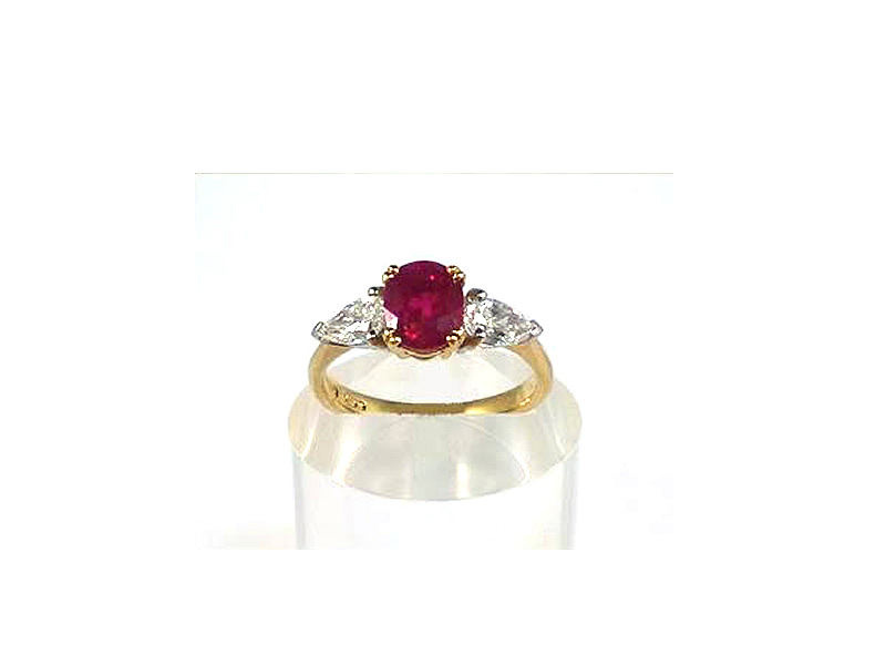 18CT GOLD & PLATINUM, 1.40CT OVAL RUBY & .65CTS PEAR SHAPED DIAMOND, THREE STONE RING